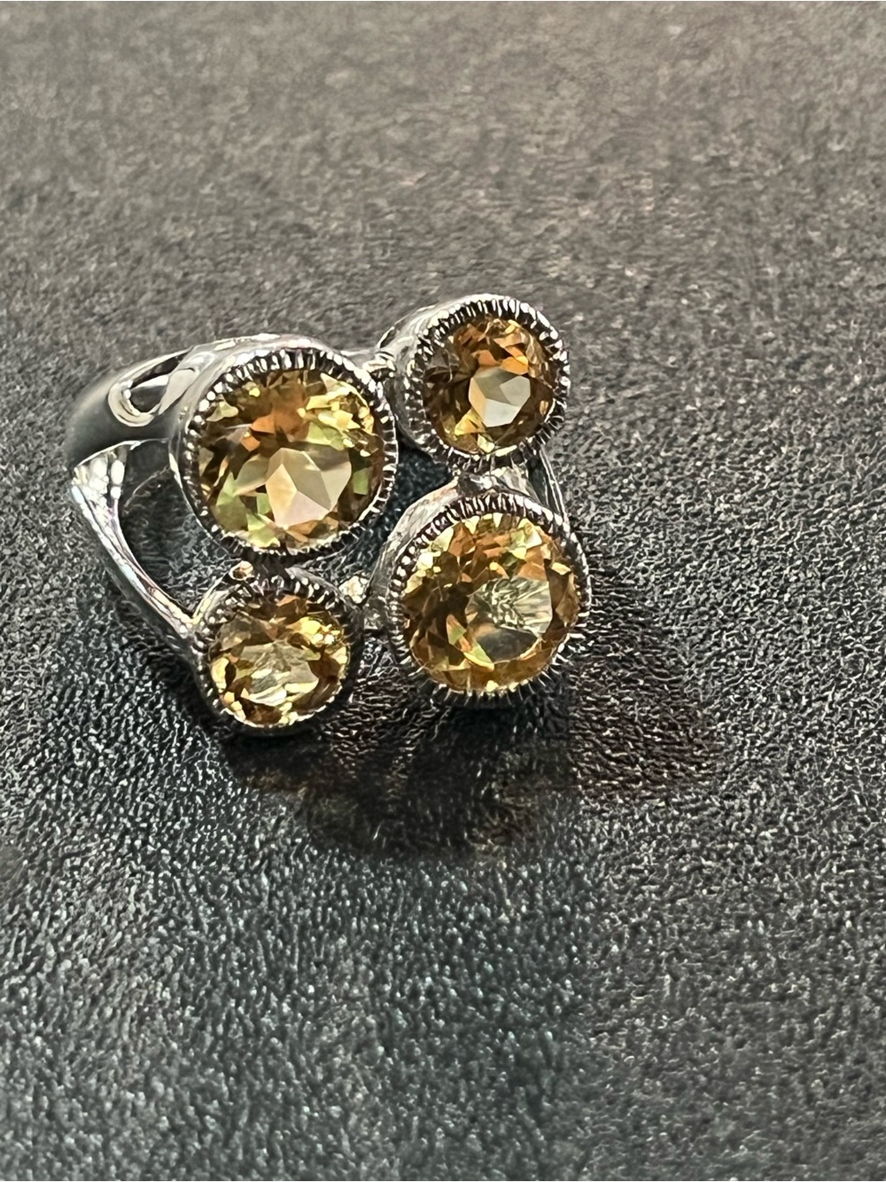 Sterling silver ring w/ 4 citrine gemstones. Sz 7. Pretty, unique design. 925